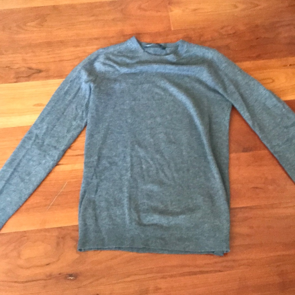 Grey sweater with pearl accents on the sleeves